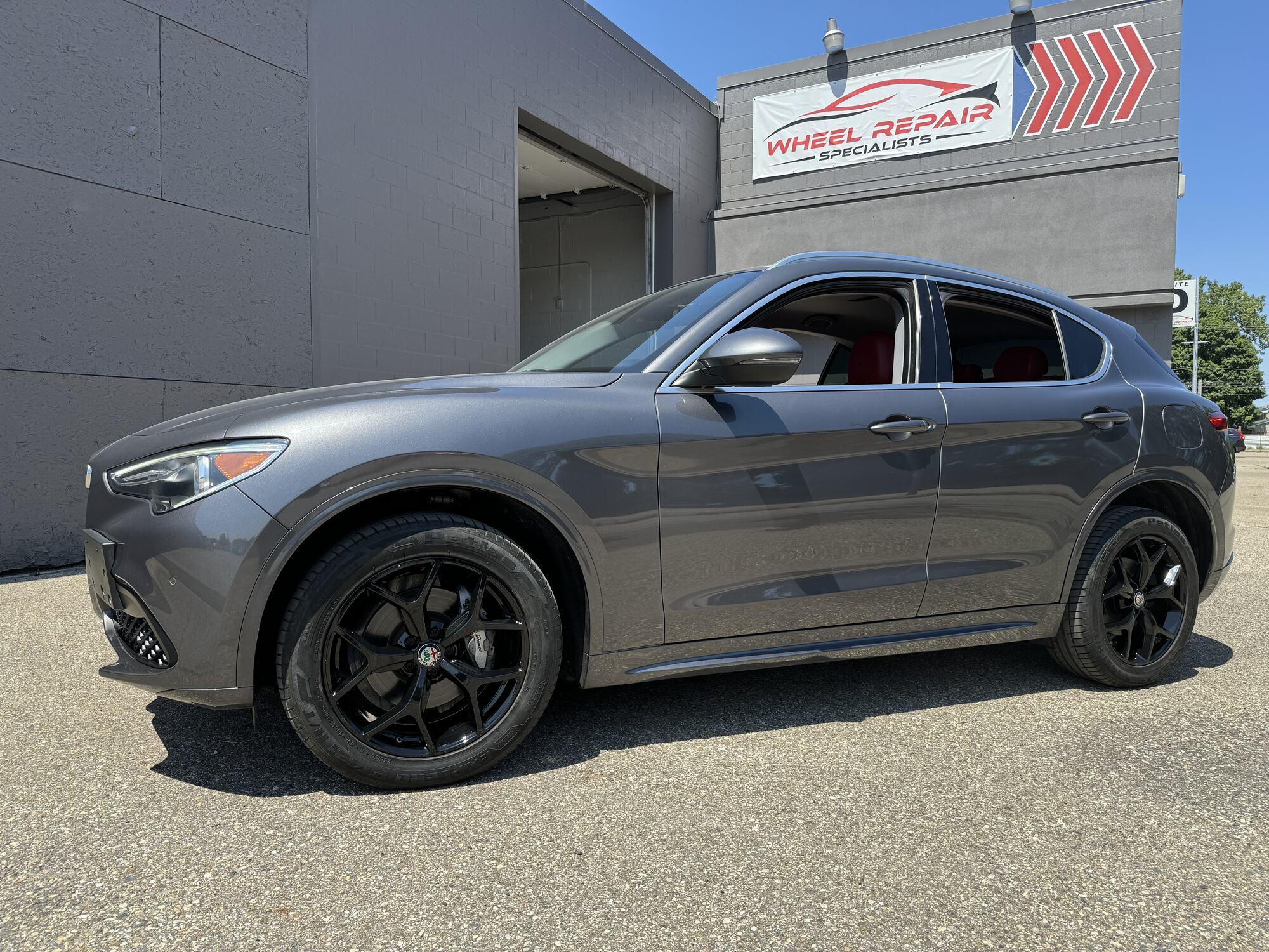 Gray Alfa Romeo Stelvio with black wheels