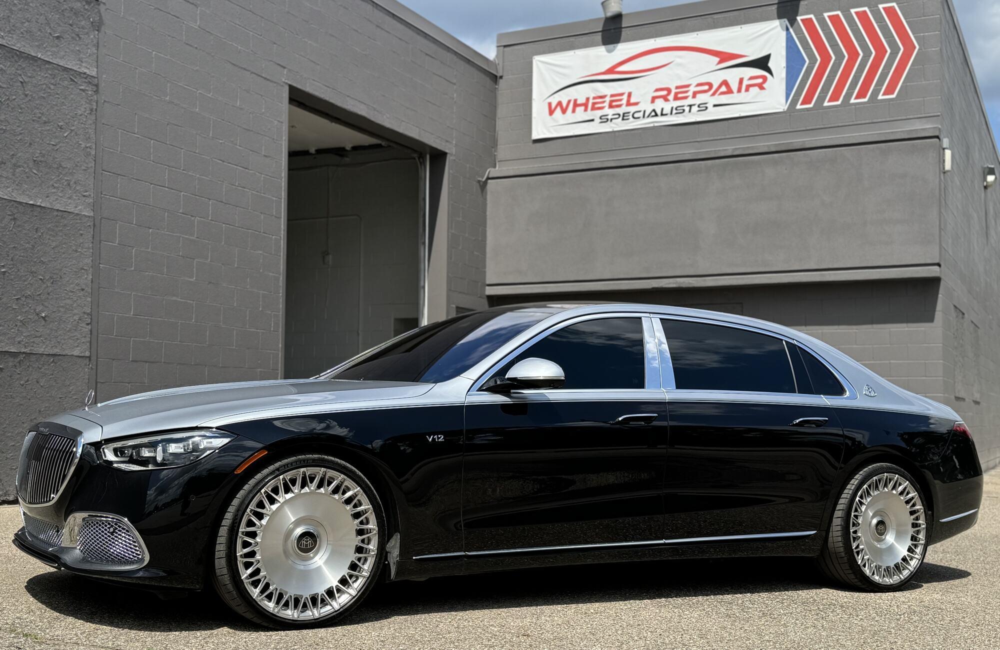 Two-tone Mercedes-Maybach S-Class with custom silver wheels outside Wheel Repair Specialists