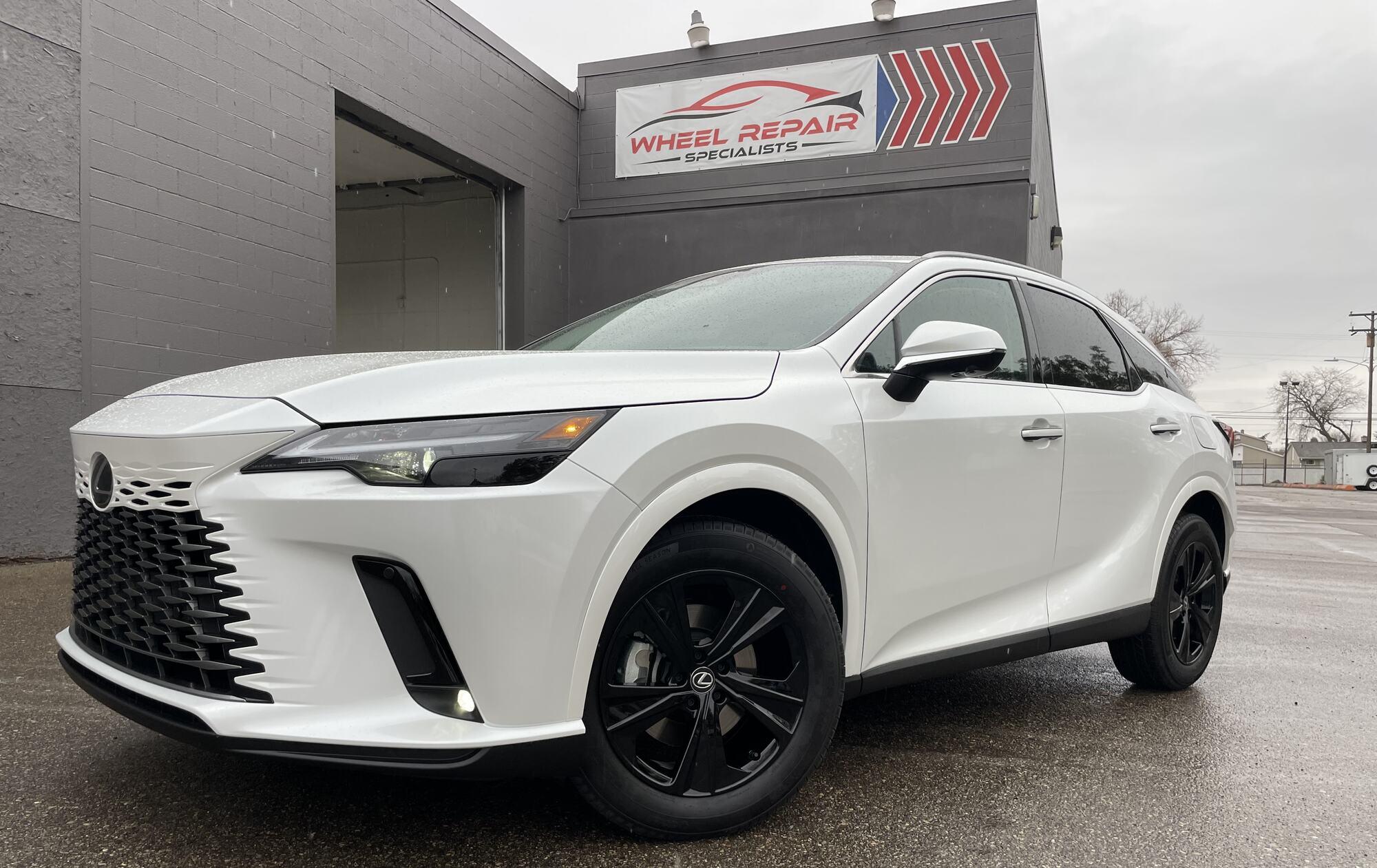 White Lexus RX with gloss black wheels
