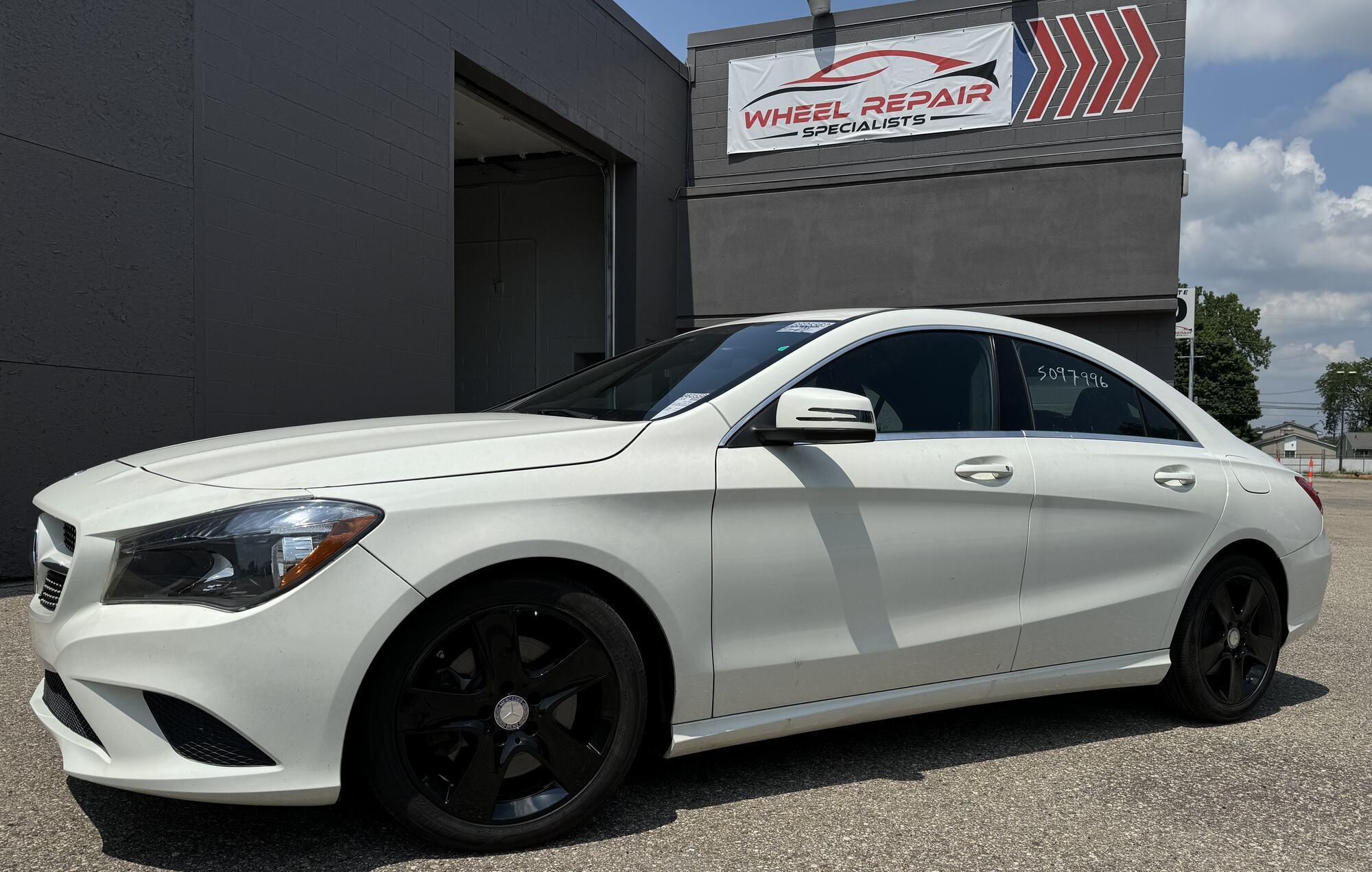 White Mercedes-Benz CLA with black wheels