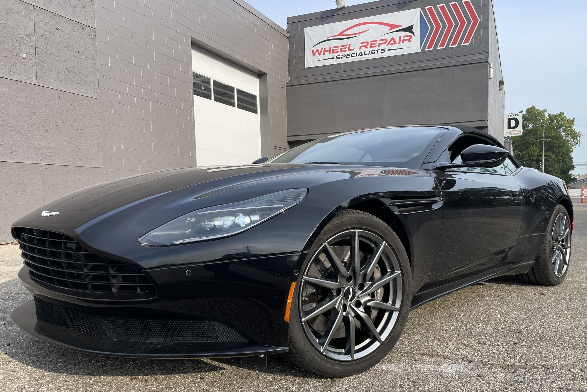 Black Aston Martin DB11 with gunmetal wheels