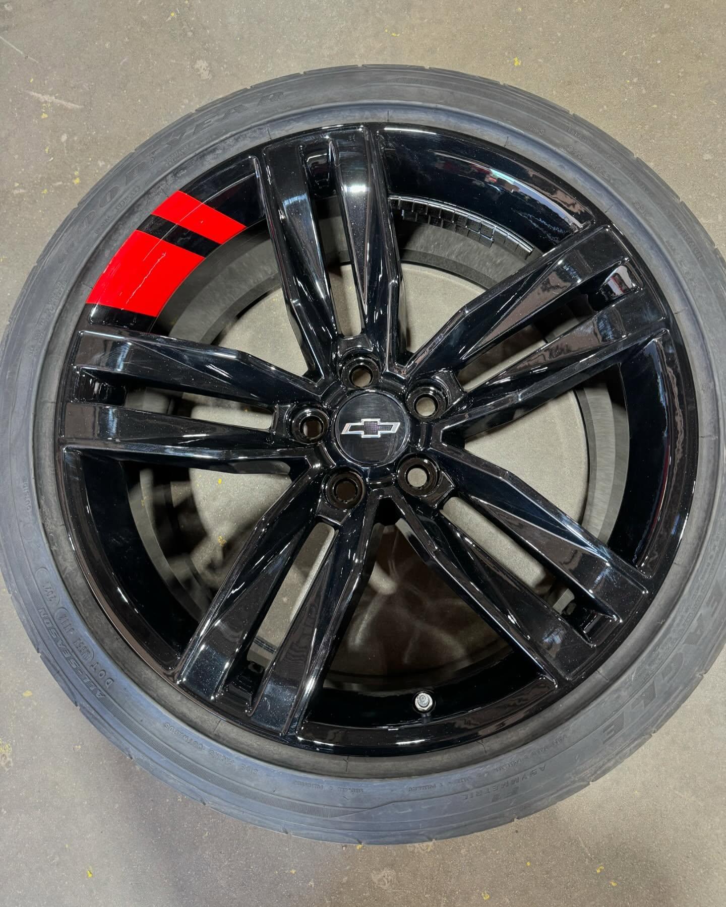Gloss black Camaro wheel after refinishing